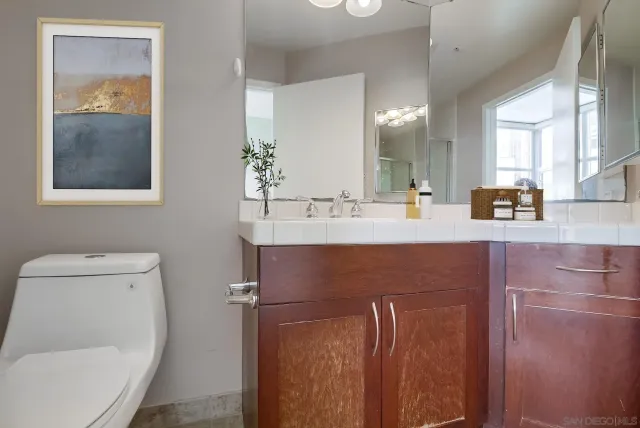a bathroom with a toilet sink and shower