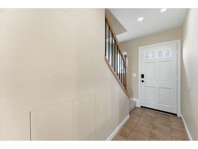 a view of an entryway with wooden floor