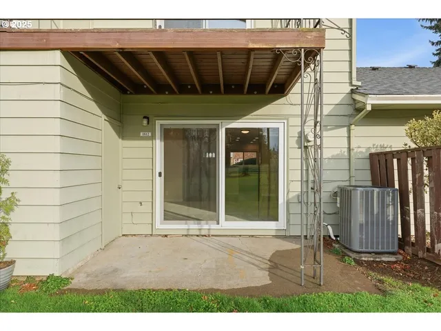 a view of a big yard with an buildings in the background