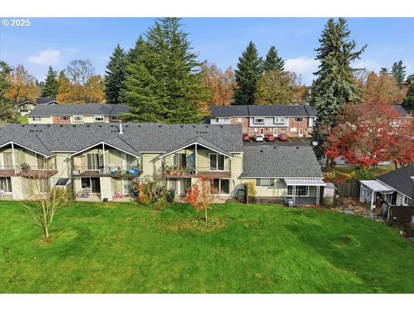 a view of a swimming pool with an outdoor seating and a garden