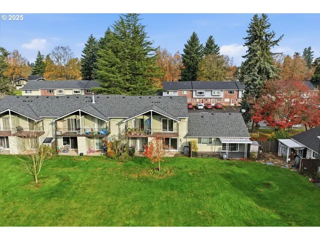 a view of a swimming pool with an outdoor seating and a garden