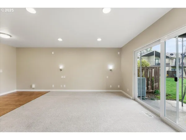 wooden floor in an empty room with glass door