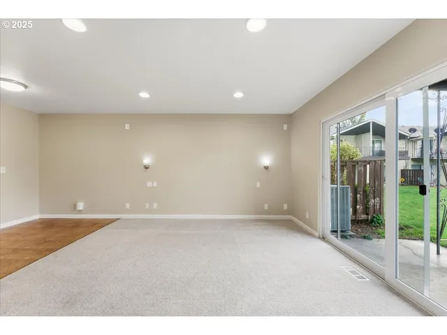 wooden floor in an empty room with glass door