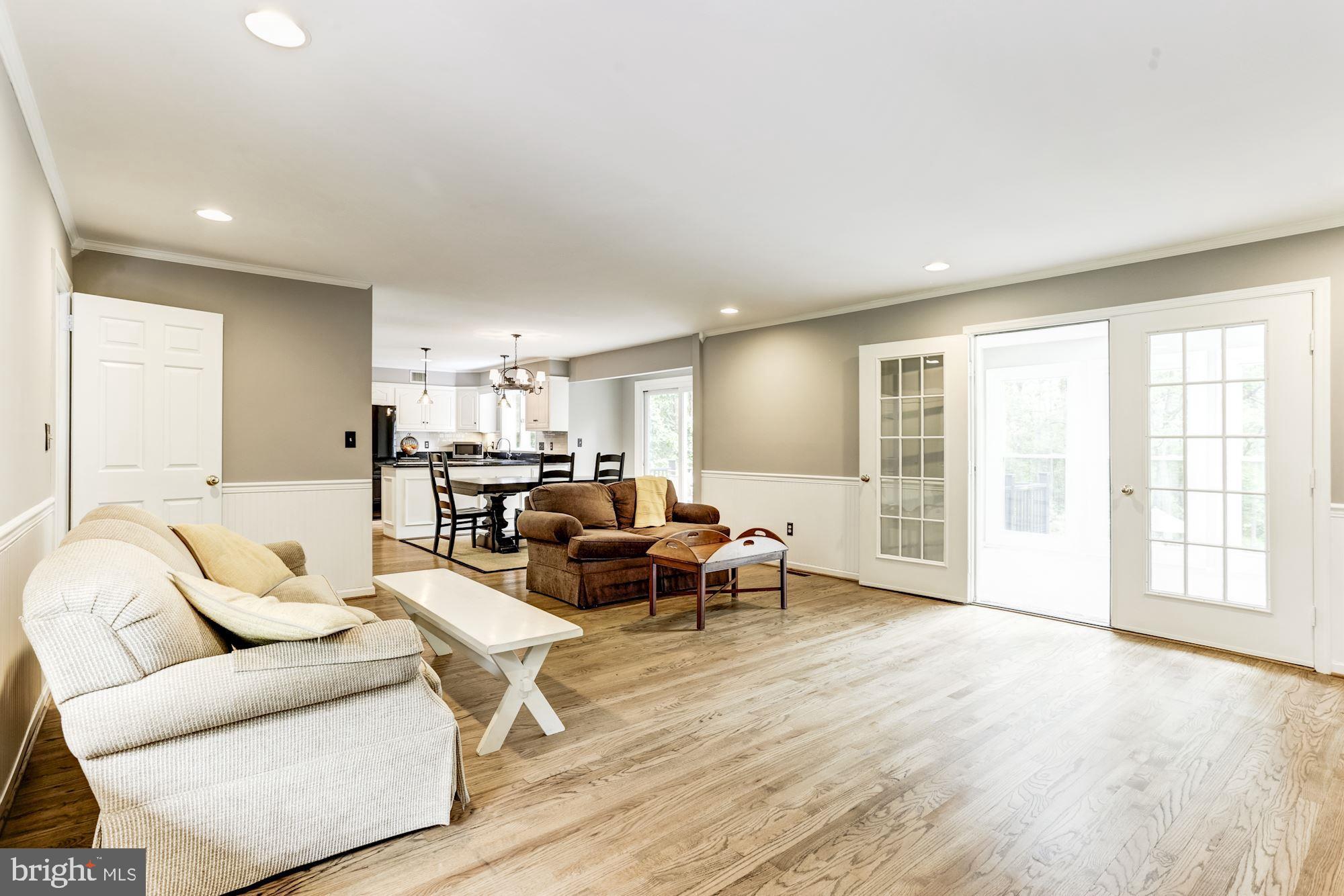 23208 Peach Tree Road Clarksburg, MD 20871 - Photo 11 of 51 Family room with doors to sun room
