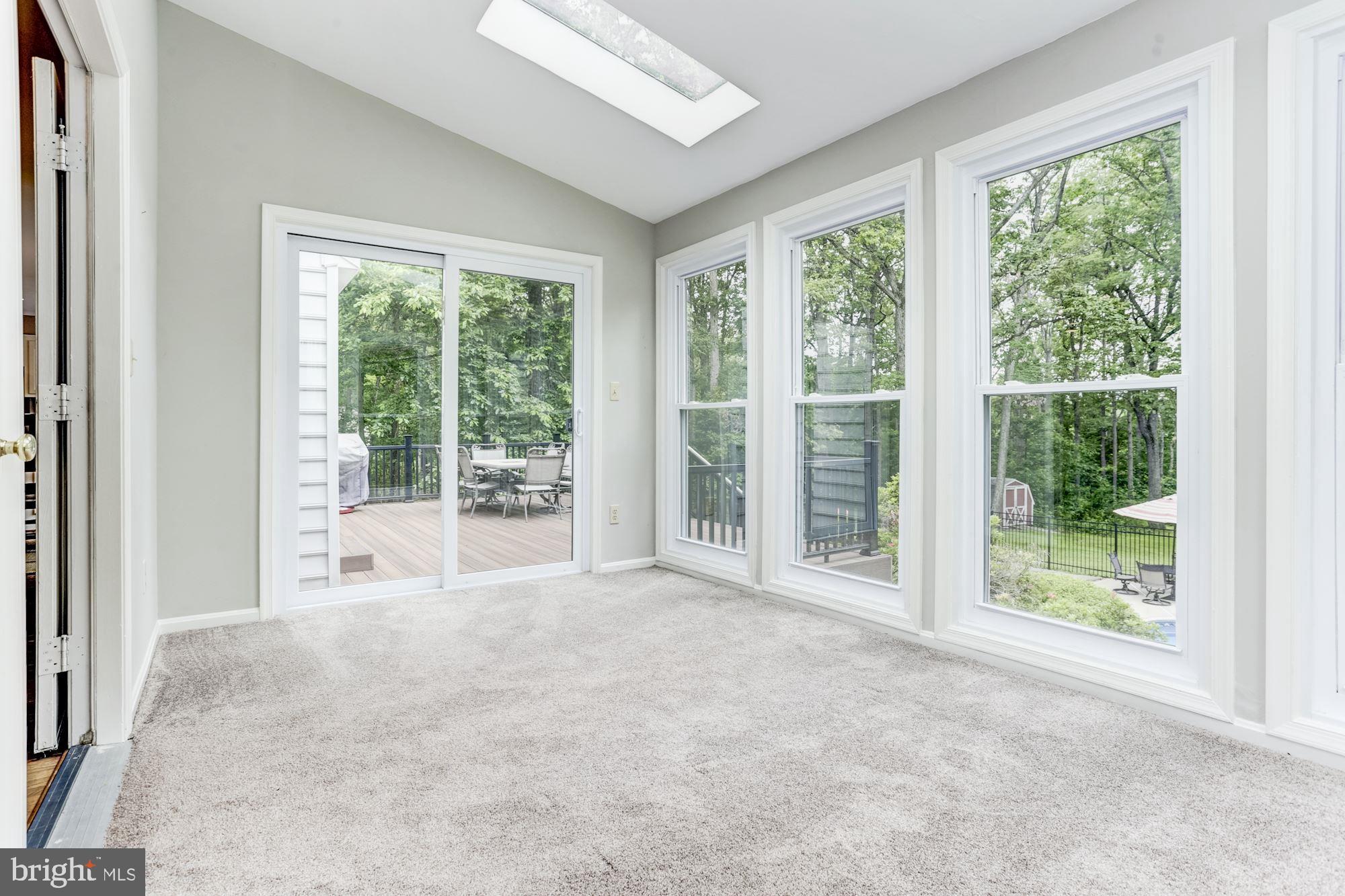 23208 Peach Tree Road Clarksburg, MD 20871 - Photo 13 of 51 All weather sun room with access to deck