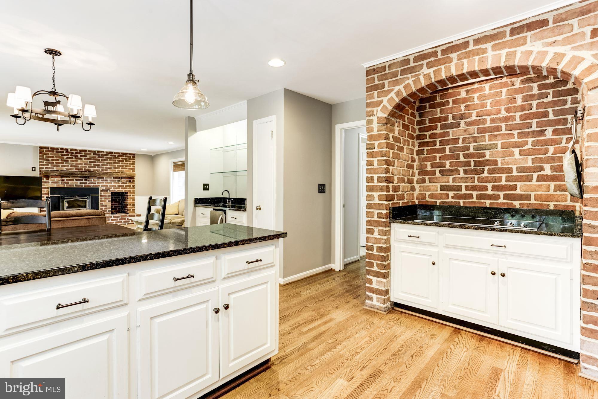 23208 Peach Tree Road Clarksburg, MD 20871 - Photo 18 of 51 Cook top with decorative brick surround