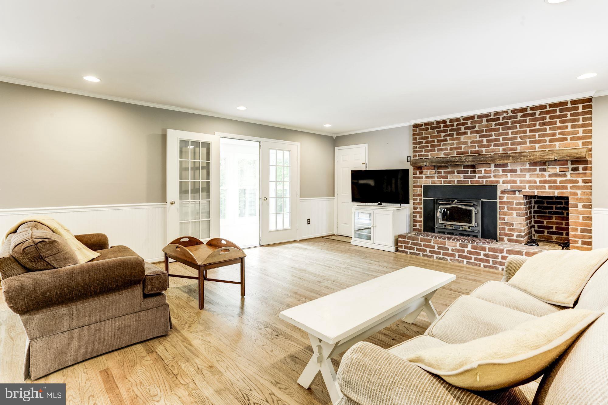23208 Peach Tree Road Clarksburg, MD 20871 - Photo 10 of 51 Family room with wood burning fireplace