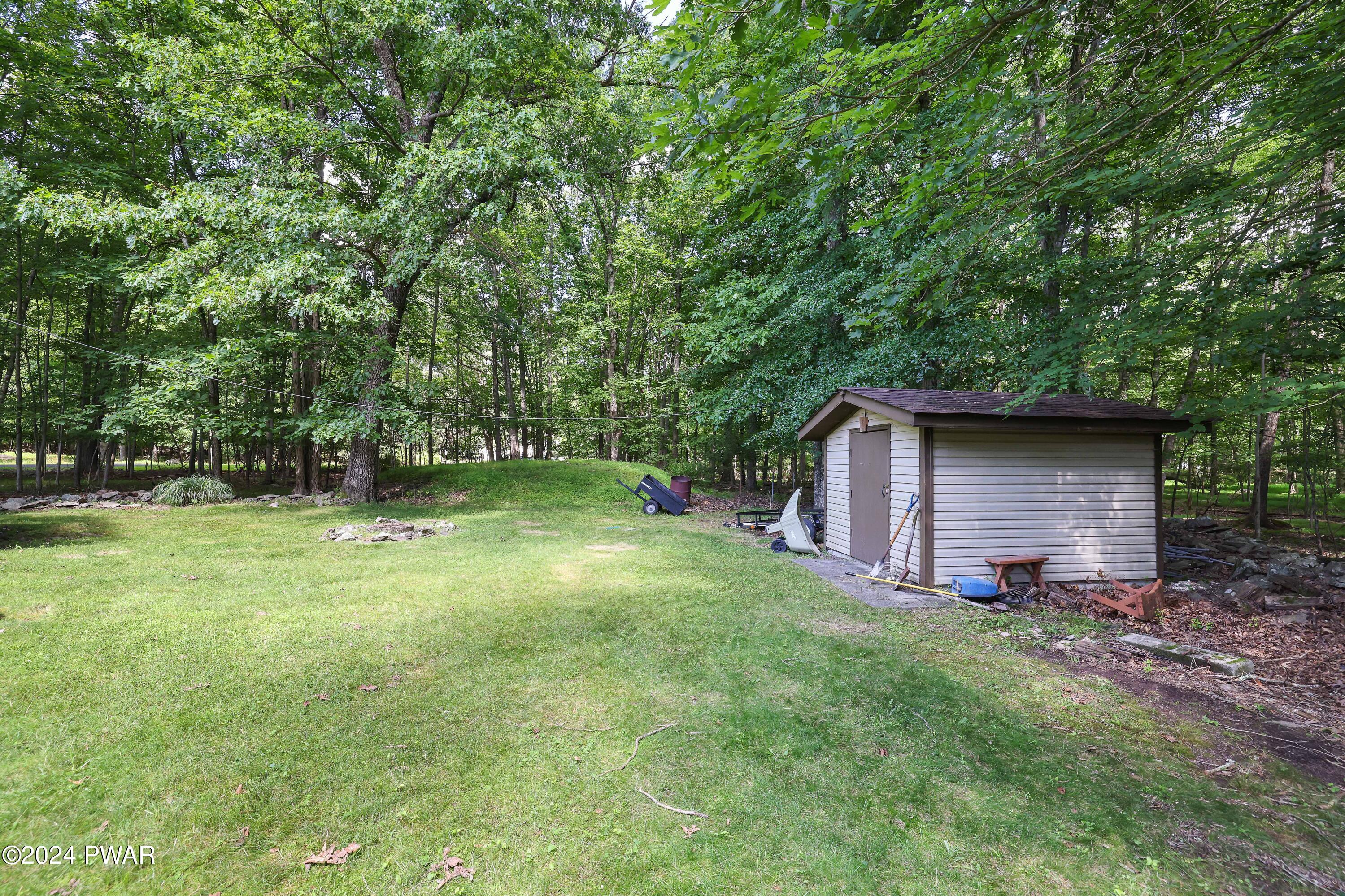 134 Magic Mountain Road Henryville, PA 18332 - Photo 12 of 62 a backyard of a house with lots of green space