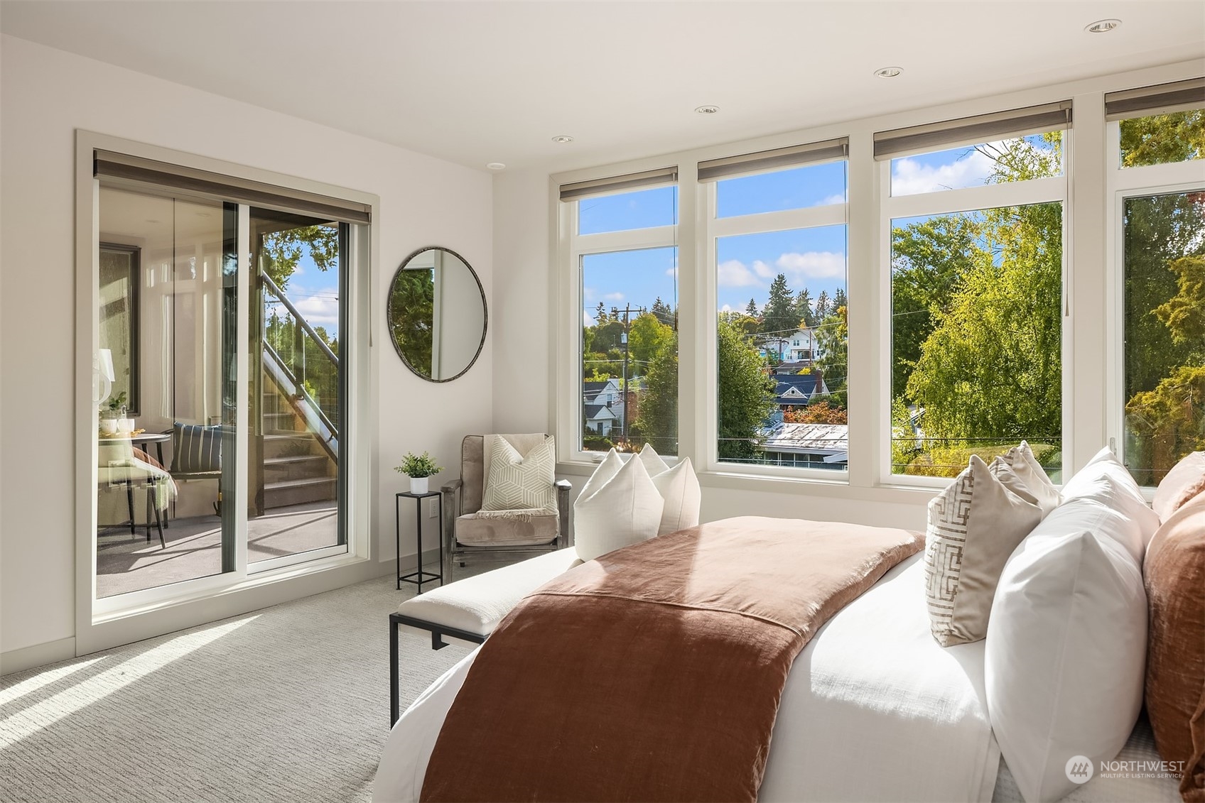 3900 Northeast 70th Street Seattle, WA 98115 - Photo 24 of 40 a bed sitting in a bedroom next to a window