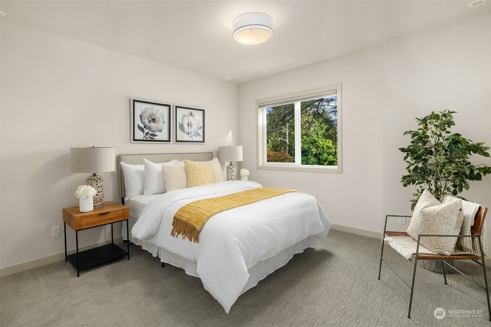 3900 Northeast 70th Street Seattle, WA 98115 - Photo 28 of 40 a bedroom with a bed and a chair