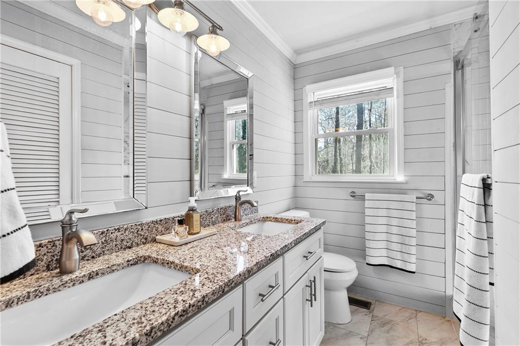 208 Shadowlawn Road Southeast Marietta, GA 30067 - Photo 13 of 25 a bathroom with a granite countertop sink and a mirror