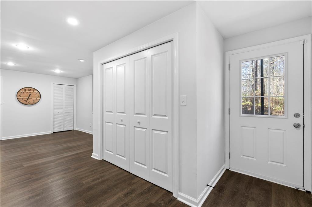 208 Shadowlawn Road Southeast Marietta, GA 30067 - Photo 15 of 25 an empty room with wooden floor and windows