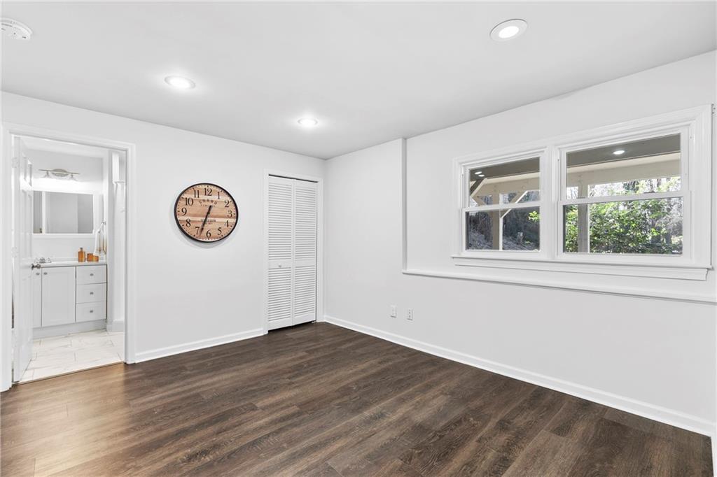 208 Shadowlawn Road Southeast Marietta, GA 30067 - Photo 17 of 25 a view of a room with wooden floor and a window