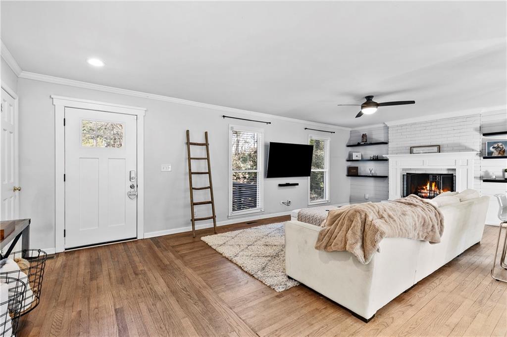 208 Shadowlawn Road Southeast Marietta, GA 30067 - Photo 2 of 25 a living room with furniture and a flat screen tv