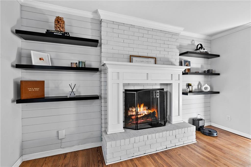 208 Shadowlawn Road Southeast Marietta, GA 30067 - Photo 3 of 25 a living room with furniture and a fireplace