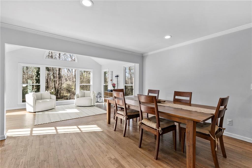 208 Shadowlawn Road Southeast Marietta, GA 30067 - Photo 4 of 25 a view of a dining room with furniture window and wooden floor
