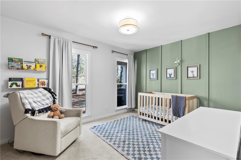 208 Shadowlawn Road Southeast Marietta, GA 30067 - Photo 10 of 25 a bedroom with furniture and a window