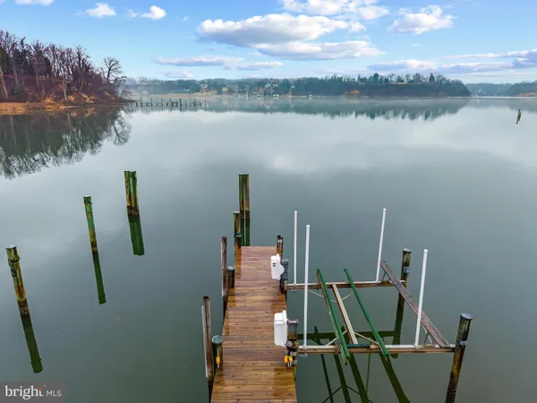 a view of a lake with outdoor seating