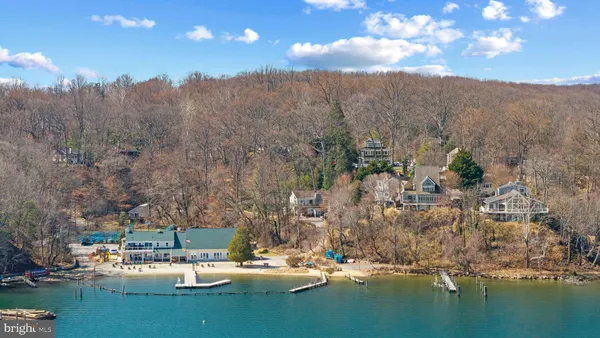 a view of a town with mountains lake view