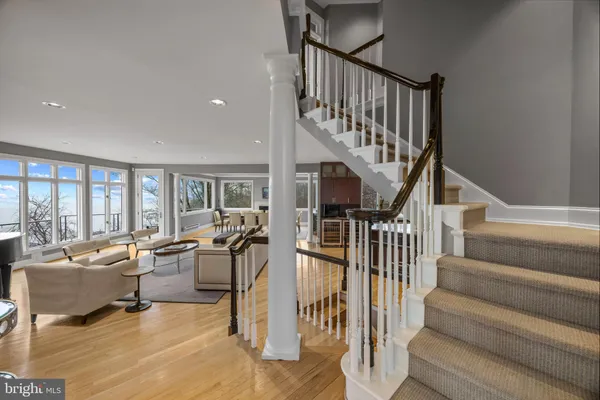 a view of entryway livingroom and hall with wooden floor