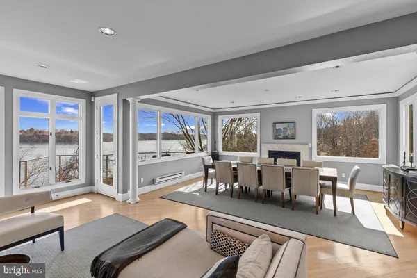 a living room with furniture large window and outer view