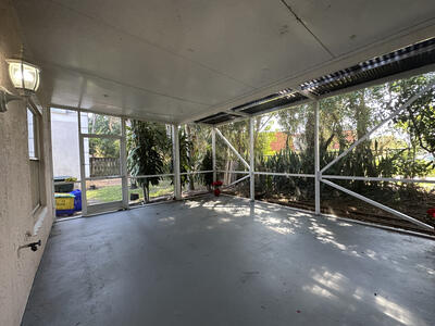140 Baldwin Boulevard Greenacres, FL 33463 - Photo 12 of 12 a view of a room with wooden floor and iron stairs