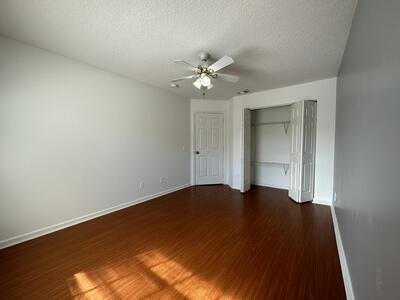 140 Baldwin Boulevard Greenacres, FL 33463 - Photo 8 of 12 wooden floor in an empty room