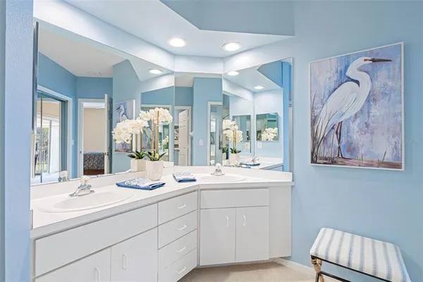 a living room with furniture and floor to ceiling window