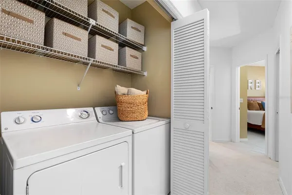 a view of a lake with houses in the background