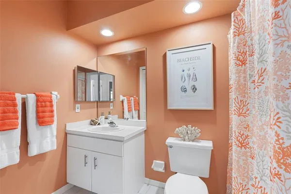 an aerial view of a houses with a lake view