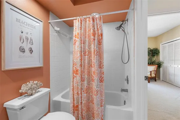 an aerial view of a house with a lake view