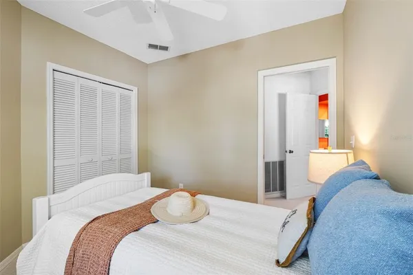 a room with pool table and windows