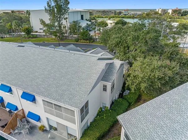 an aerial view of a houses with a lake view