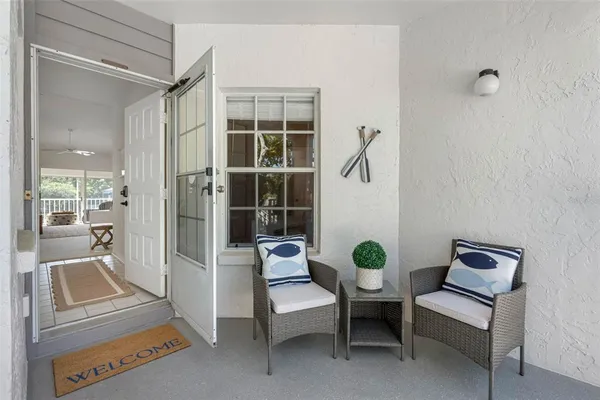 a kitchen with stainless steel appliances a stove a refrigerator cabinets and a wooden floor