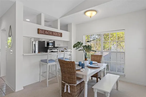 a kitchen with cabinets appliances a sink and a counter top space