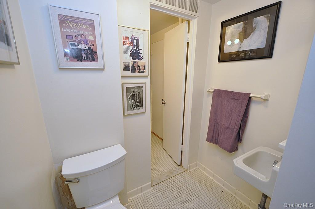 235 Garth Road, Unit A5B Scarsdale, NY 10583 - Photo 26 of 47 a bathroom with a toilet and a shower