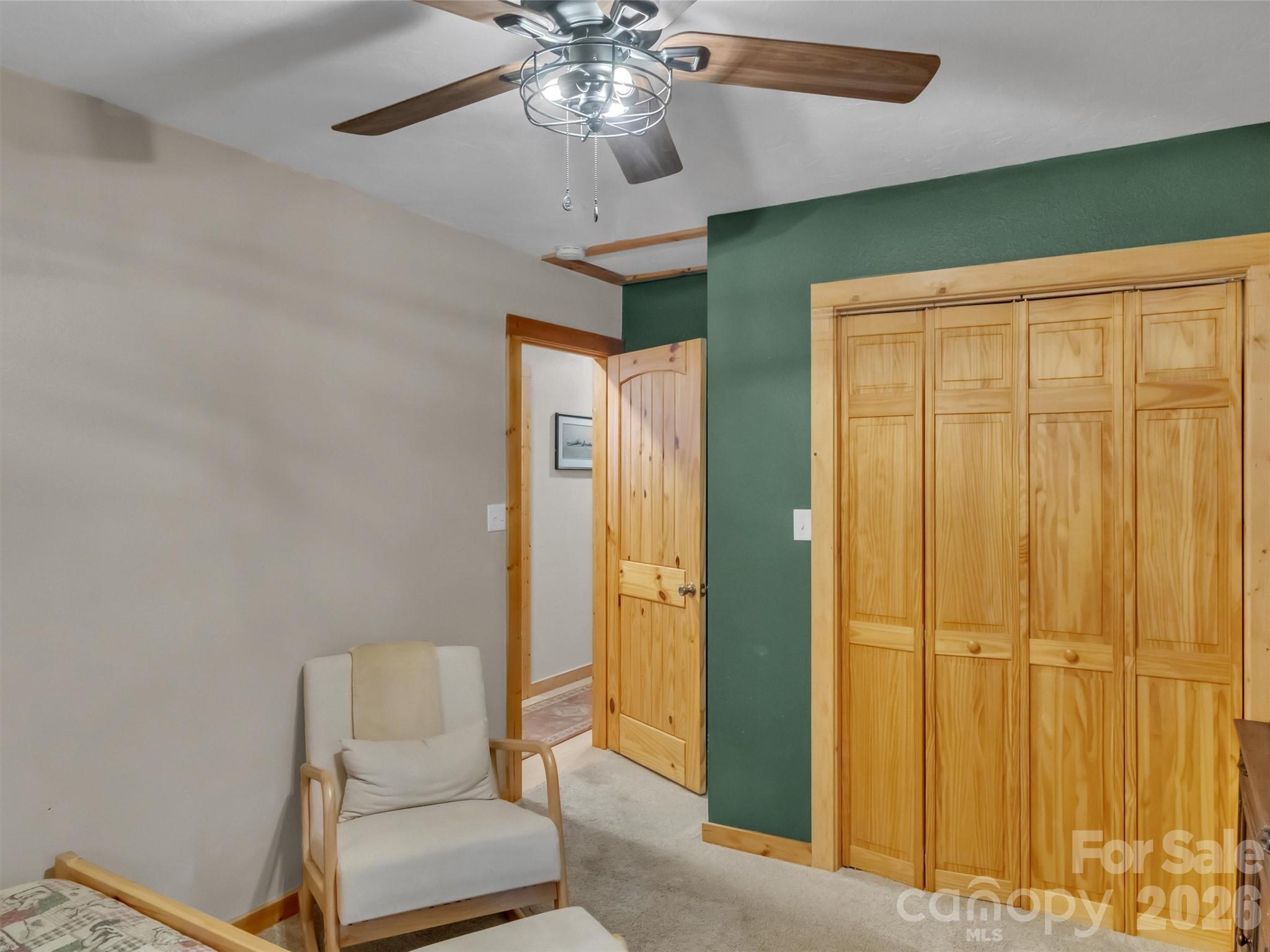 49 Brandywine Road Waynesville, NC 28786 - Photo 16 of 38 a view of a livingroom with a chandelier fan and a bathroom