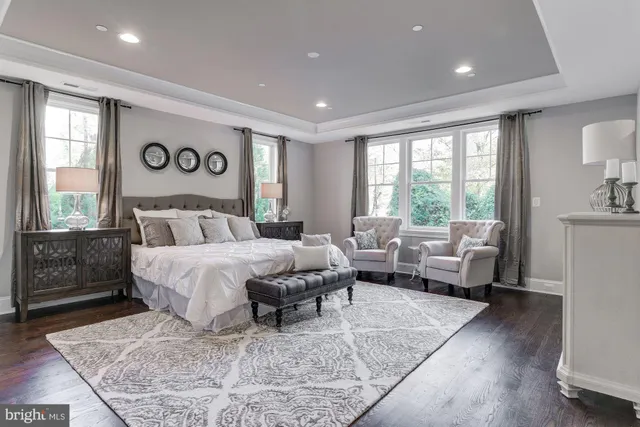 a bedroom with a large bed and a couch