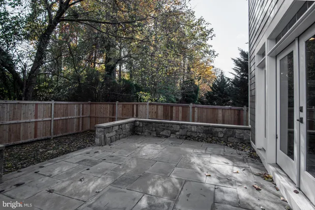 a view of outdoor space with wooden fence