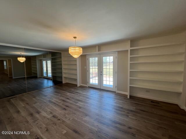368 Graham Bridge Road Rockingham, NC 28379 - Photo 13 of 40 Sitting Room with Buit-in Bookshelves and Unique Mirror Wall