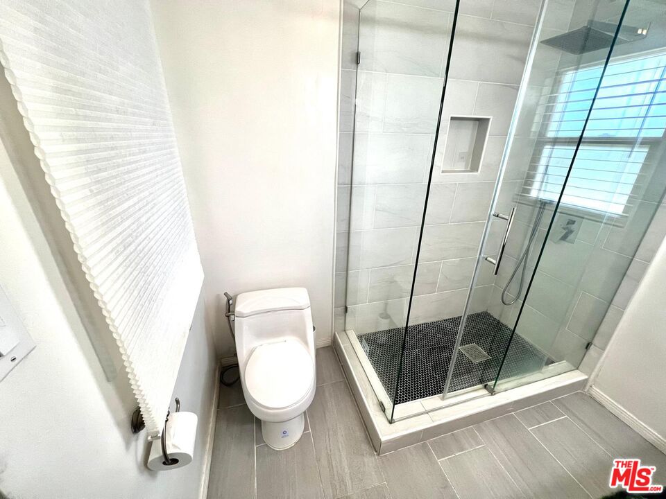 4340 Sepulveda Boulevard Sherman Oaks, CA 91403 - Photo 11 of 30 a bathroom with a toilet and a shower