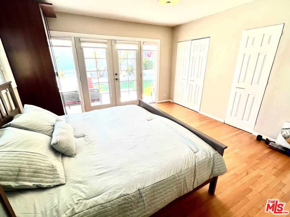 4340 Sepulveda Boulevard Sherman Oaks, CA 91403 - Photo 12 of 30 a large white bed sitting in a room next to a window
