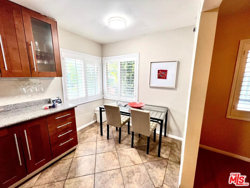 4340 Sepulveda Boulevard Sherman Oaks, CA 91403 - Photo 20 of 30 a view of a dining room with furniture and wooden floor