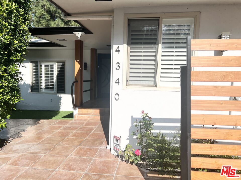 4340 Sepulveda Boulevard Sherman Oaks, CA 91403 - Photo 28 of 30 a front view of a house with a yard