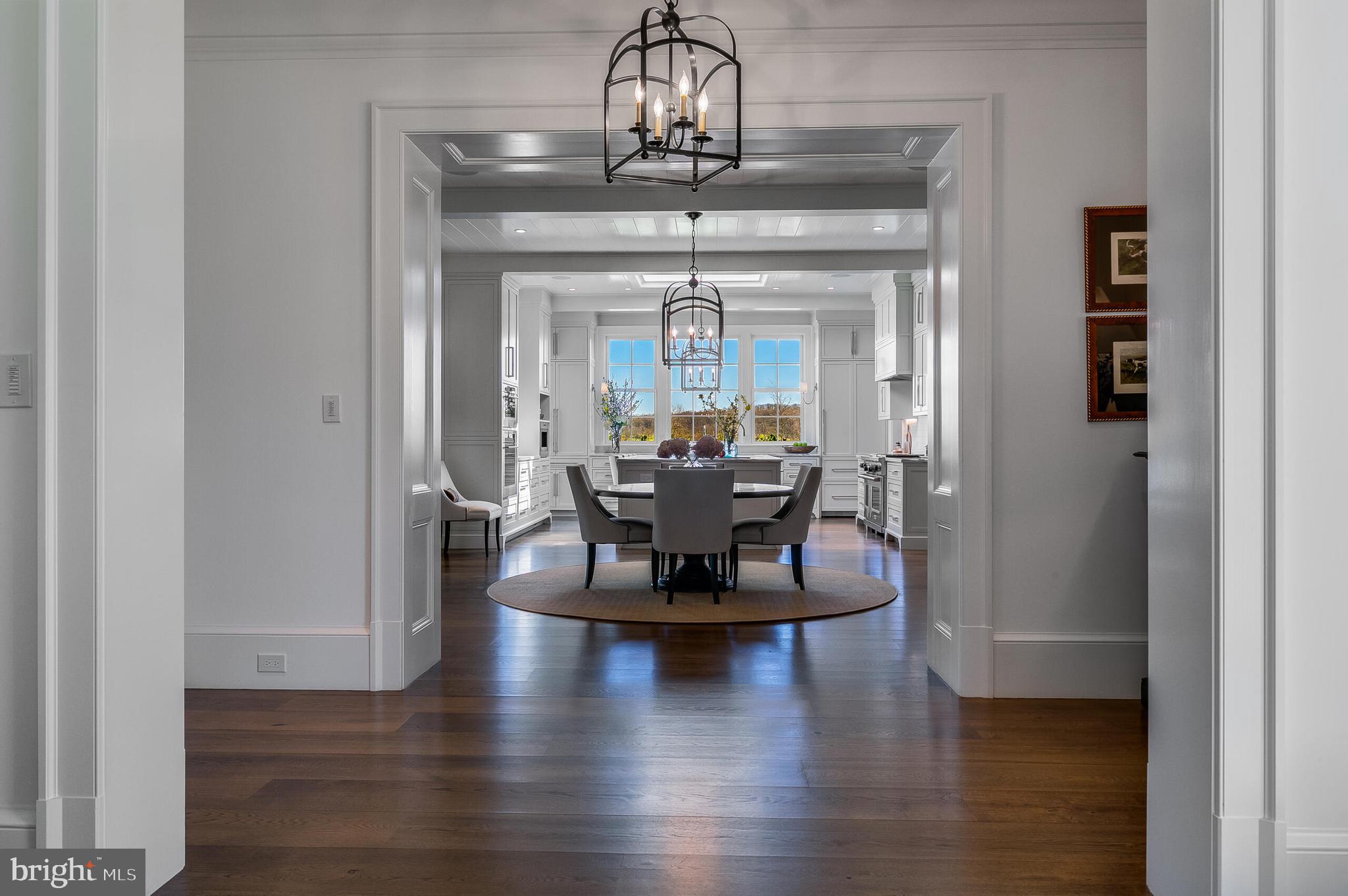 7316 Old Carters Mill Road The Plains, VA 20198 - Photo 16 of 61 a view of a dining room with furniture wooden floor and a chandelier