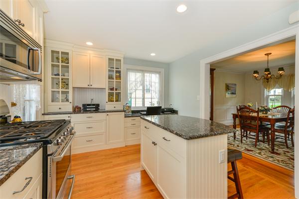 8 Richfield Road Arlington, MA 02474 - Photo 15 of 25 a kitchen with stainless steel appliances granite countertop a sink stove and cabinets