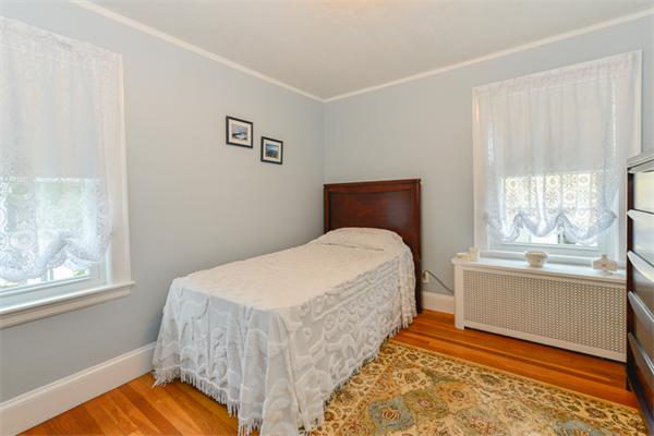 8 Richfield Road Arlington, MA 02474 - Photo 21 of 25 a bedroom with a bed and a window