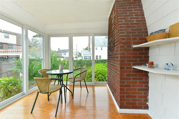 8 Richfield Road Arlington, MA 02474 - Photo 6 of 25 a view of a chairs and table in the balcony