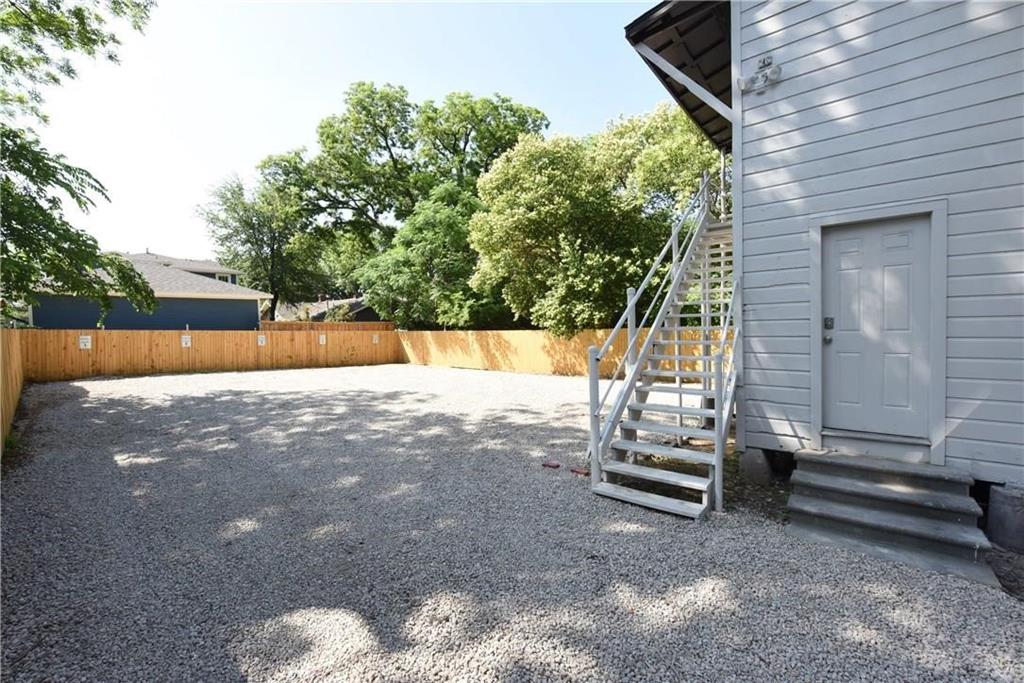4612 Junius Street, Unit B Dallas, TX 75246 - Photo 11 of 14 a view of backyard with wooden fence