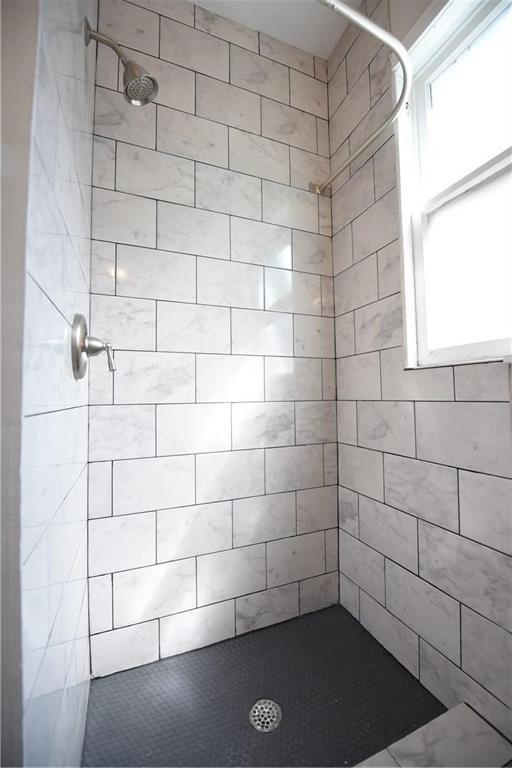 4612 Junius Street, Unit B Dallas, TX 75246 - Photo 7 of 14 a bathroom with a shower